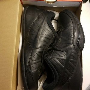 All black Nike shoes